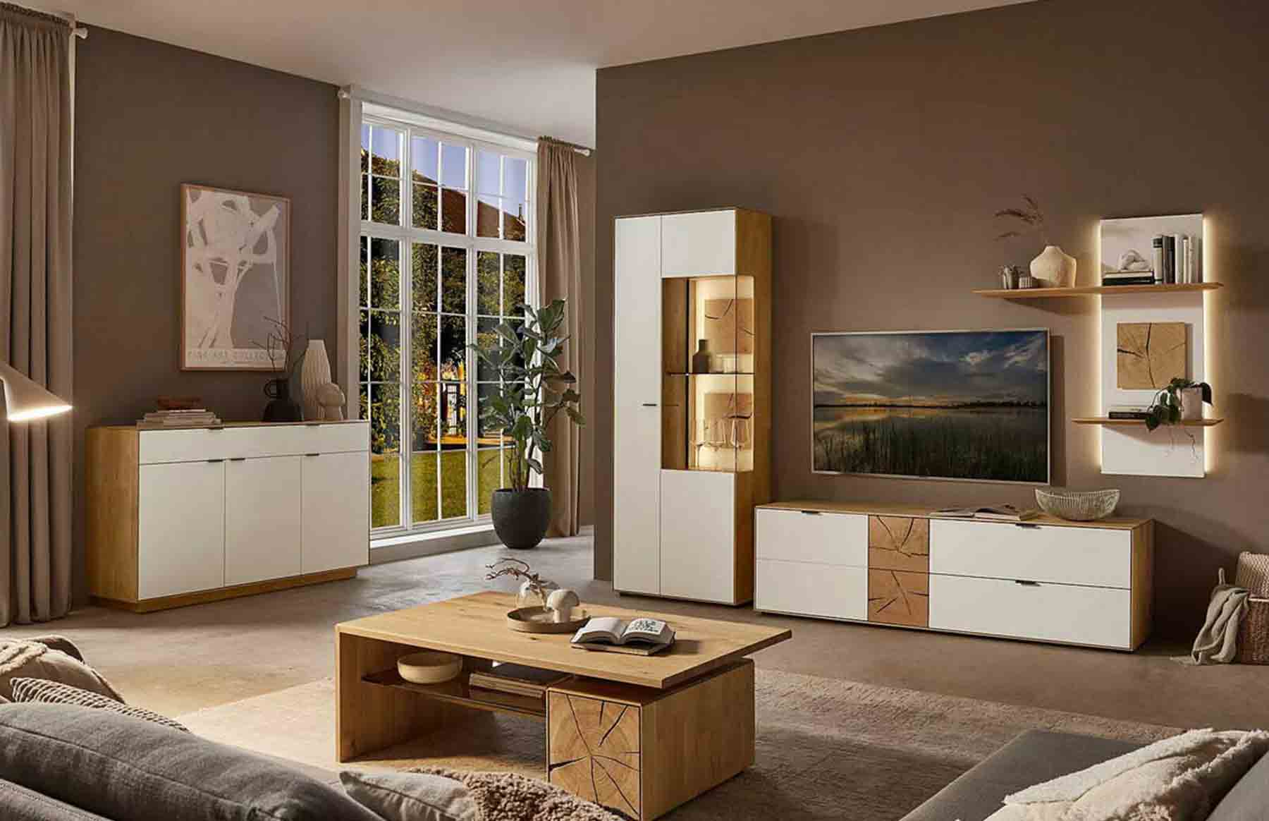 Wohnzimmer WM 2410 Hier werden Sie zur WM 2410 Kategorie weitergeleitet. Kachel zeigt Wohnwand in Wildeiche mit Lack Front in weiß kombiniert mit Hirnholz Akzent, bestehend aus 1 Lowboard, Zeilenschrank inklusive Vitrinenfach plus Wandpaneel.